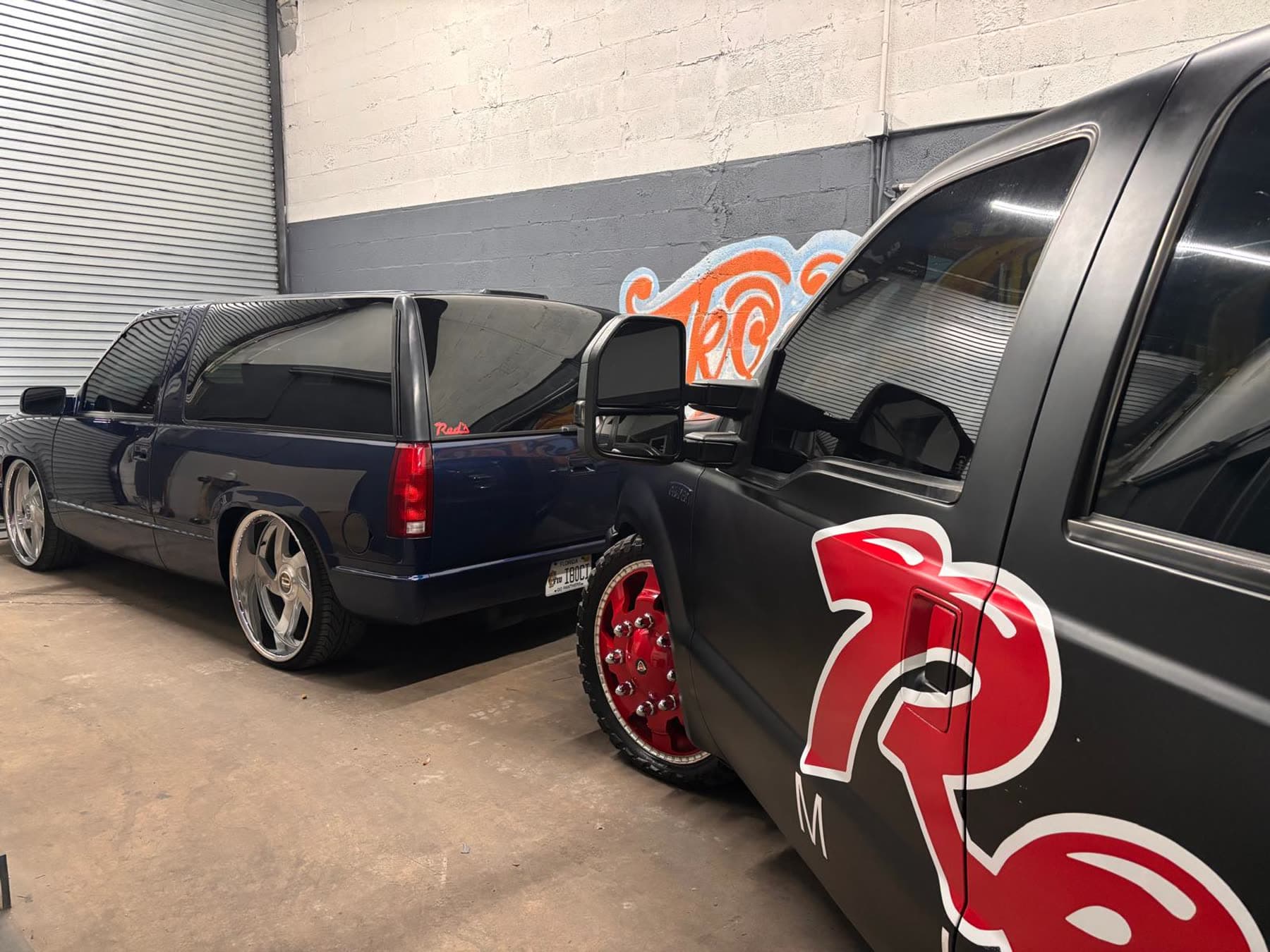 Black dually detail with red wheel and Diesel Wheels graphic