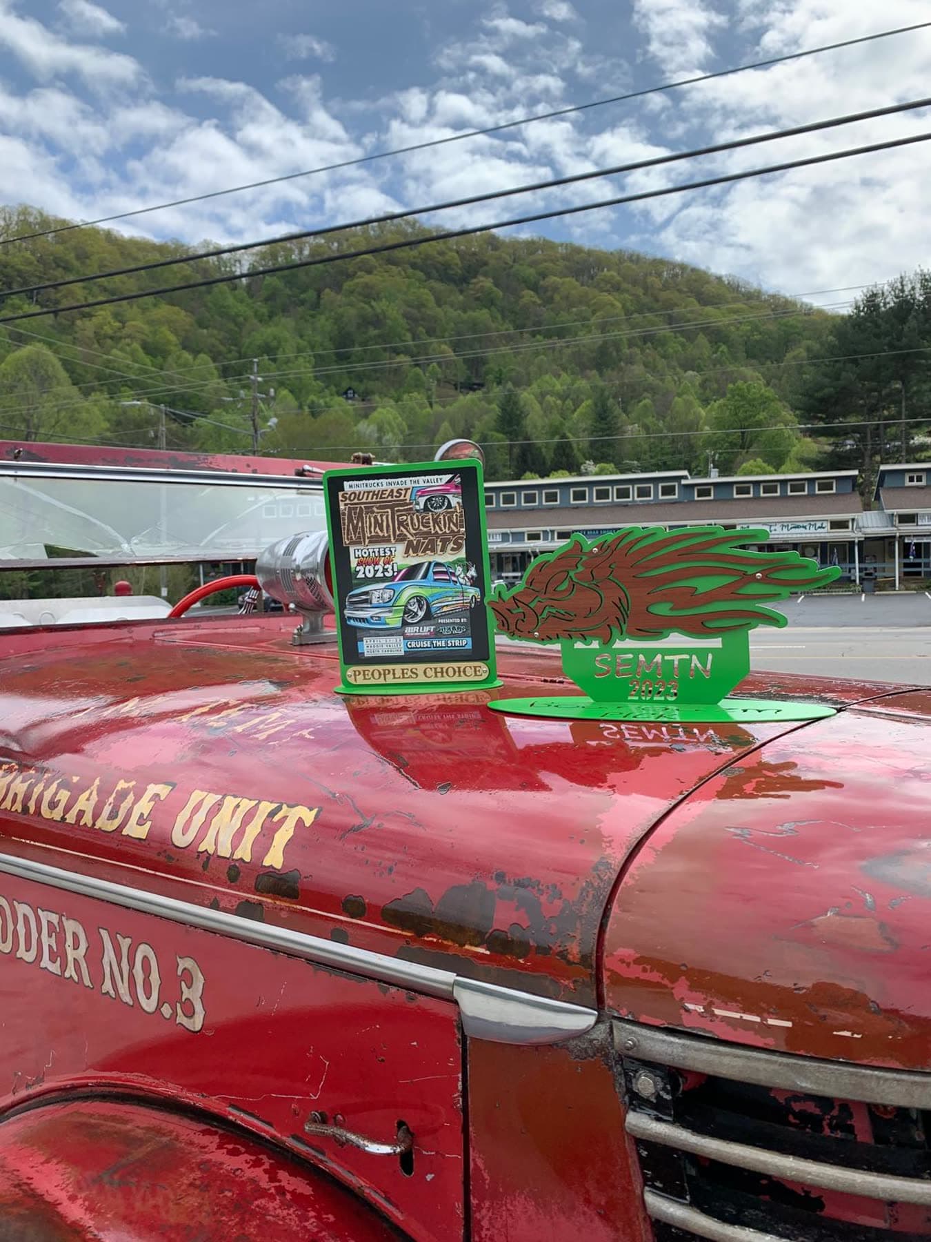 Red rat rod hood and shop scenery