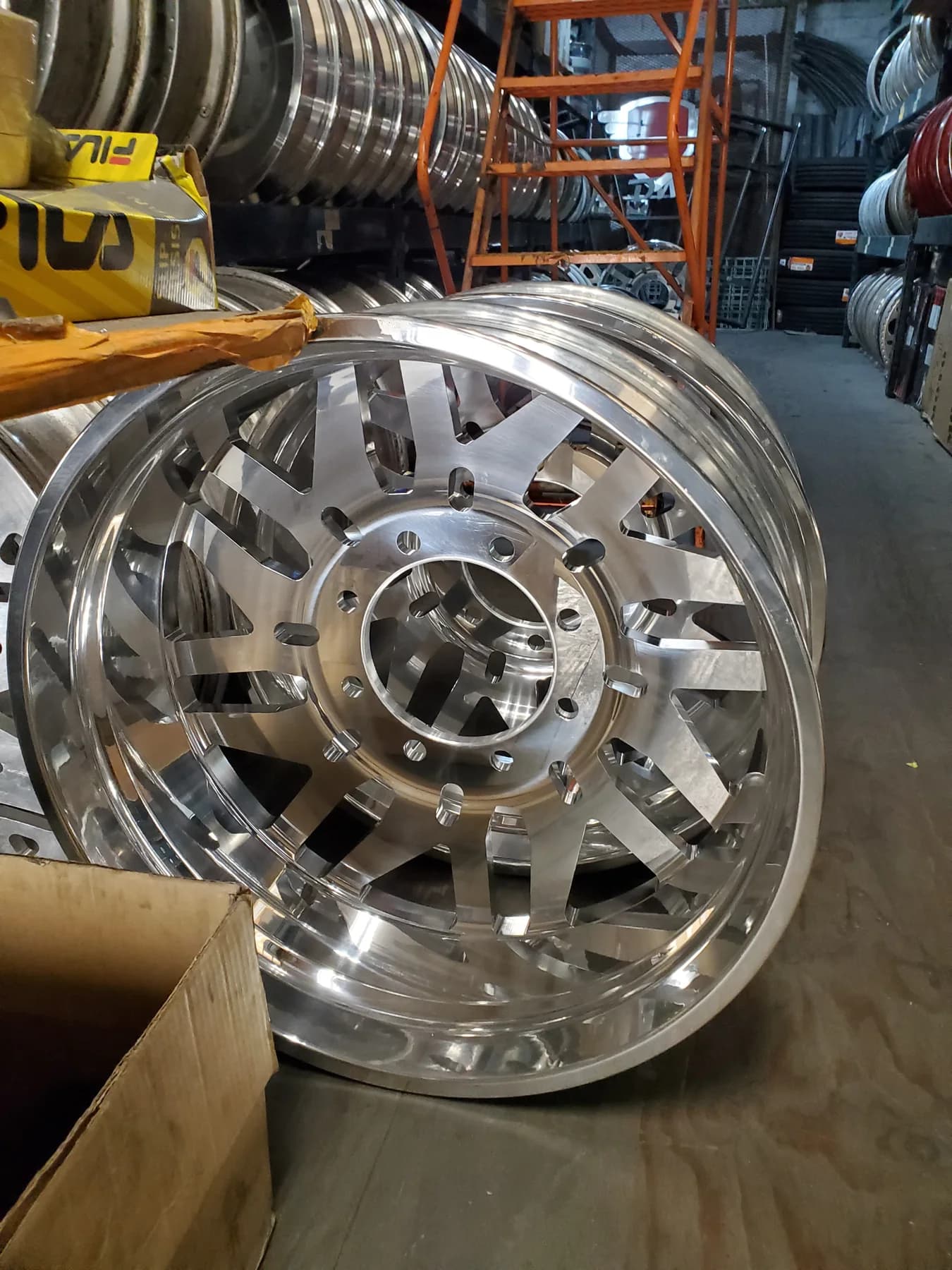 Machined truck wheels displayed inside the Diesel Wheels shop